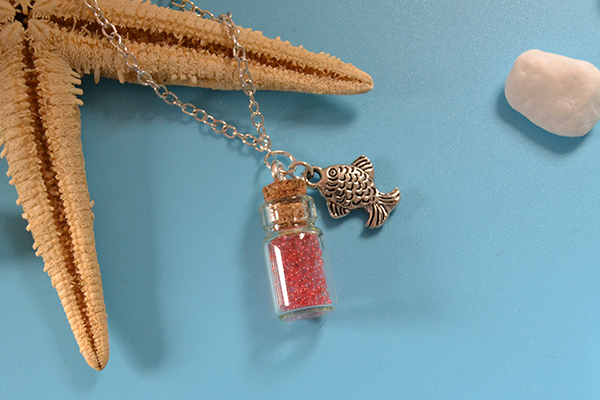 final look of the bottle and fish pendant necklace