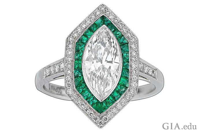 An Art Deco inspired ring with a 1.09 carat (ct) center stone, 0.35 carats of lush emeralds, and another 0.21 carats of diamonds