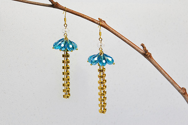 blue glass bead and golden chain tassel drop earrings