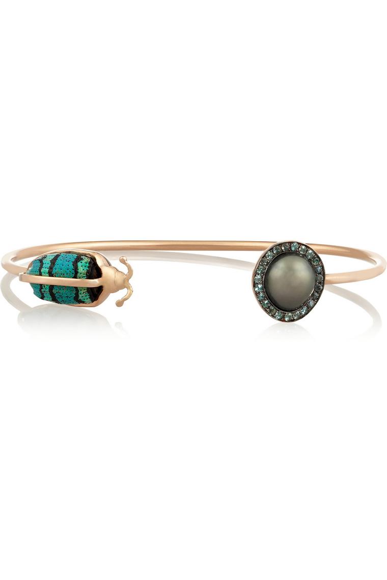 Daniela Villegas one-of-a-kind rose gold, South Sea pearl, garnet and weevil bracelet. Available at net-a-porter.com ($6,250).