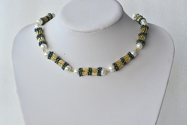 final look of the golden bugle seed bead, blue seed bead and white pearl necklace