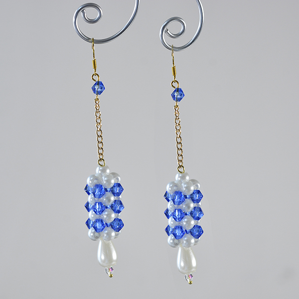 final look of the long column drop earrings with blue glass beads and white pearl beads