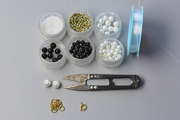 Supplies needed for the handmade white and black pearl necklace: