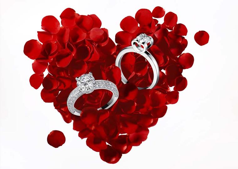 Chopard Passion for Happiness collection platinum rings both feature a solitaire diamond: one of the rings features a solitaire dramatically elevated on a double, heart-shaped platform; the other, more classical solitaire, is enhanced by smaller diamonds 