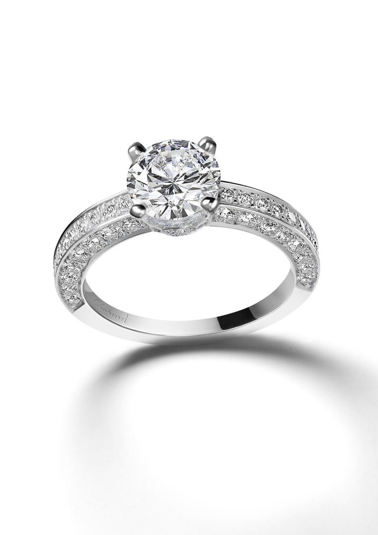 Chopard Passion for Happiness collection white gold solitaire diamond ring featuring an additional swath of diamonds along the tops and sides of the band.