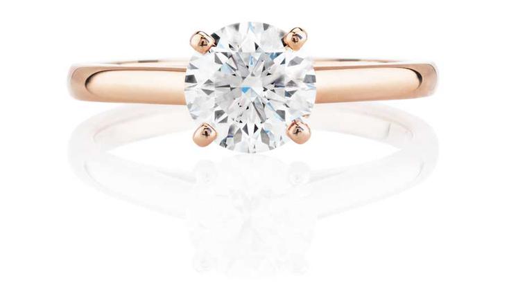 Simple and elegant, this De Beers rose gold engagement ring is flawless and illustrates perfectly how rose gold intensifies the bright white sparkle of a diamond.