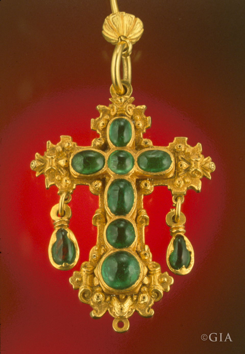 A cross set with emerald cabochons was one of the treasures brought up from the sunken Nuestra Señora de Atocha. Photo by Shane F. McClure/GIA.
