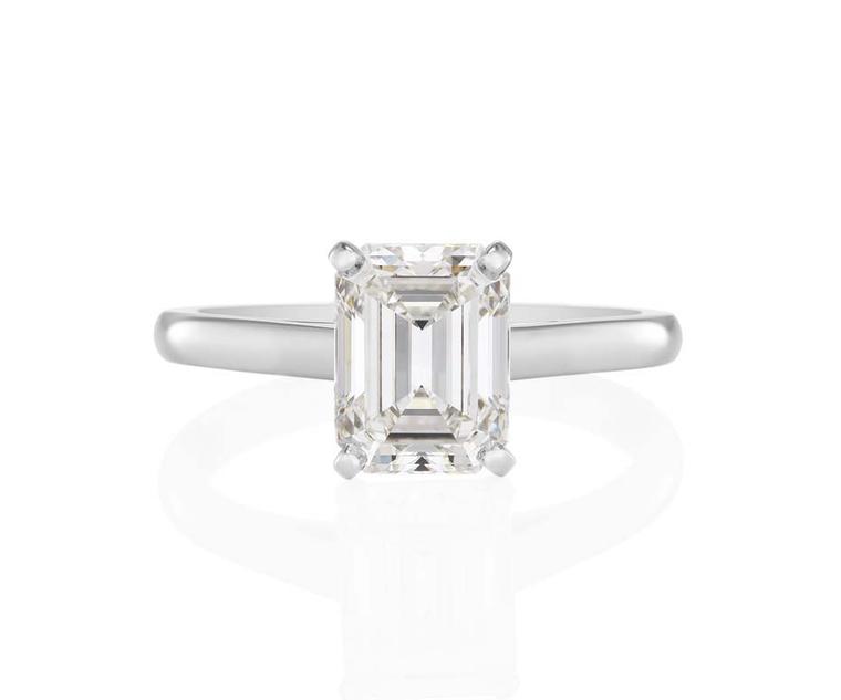 De Beers Classic Solitaire engagement ring featuring a four-prong-set emerald-cut solitaire on a platinum ban