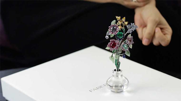 This beautiful Fabergé brooch takes the form of a delicate spray of flowers and, when not being worn, sits in a little rock crystal vase.