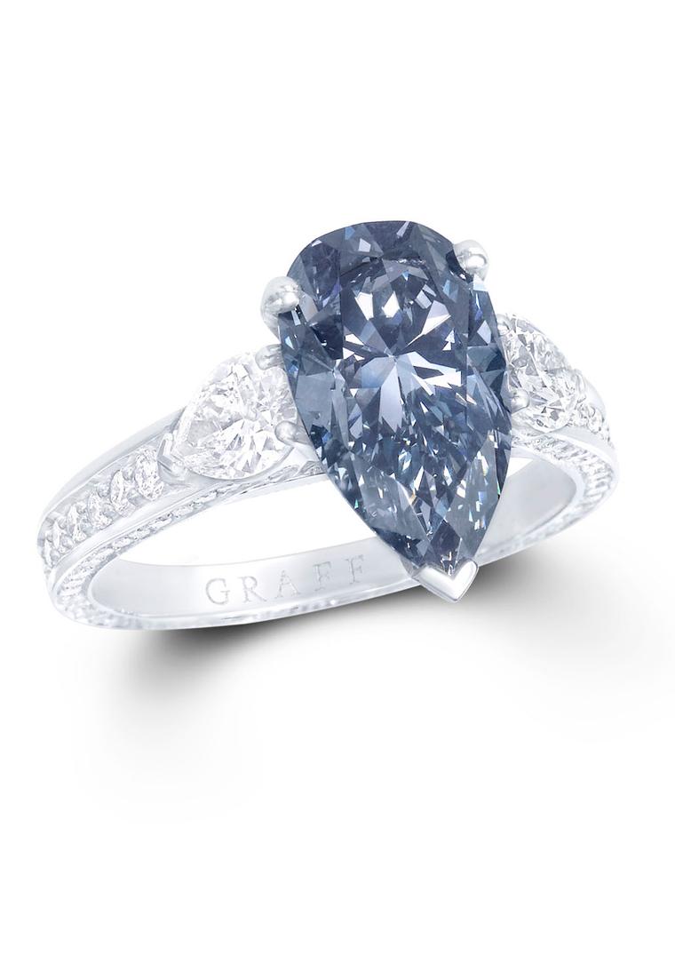 Graff 3.15ct Fancy Dark Greyish Blue diamond engagement ring with a white diamond band.
