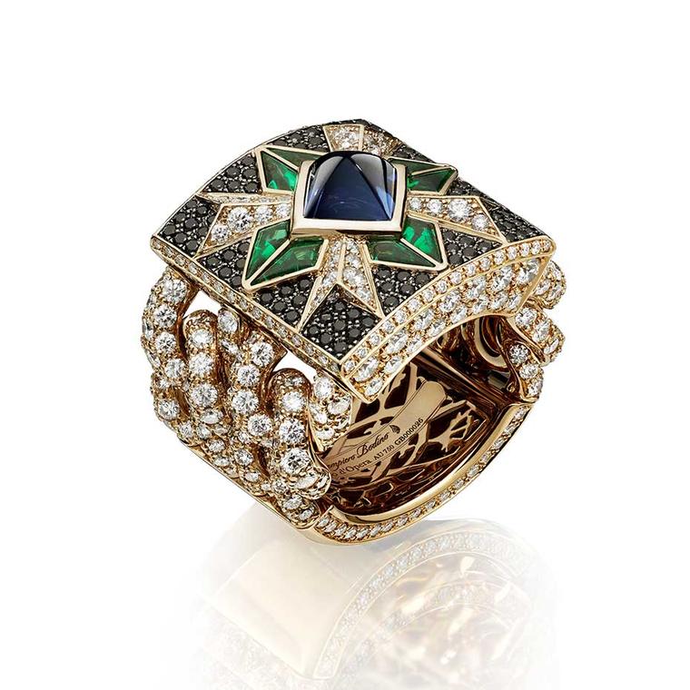 Giampiero Bodino Rosa dei Venti ring set with a central sugarloaf sapphire, emeralds and black diamonds on a diamond-encrusted chain.