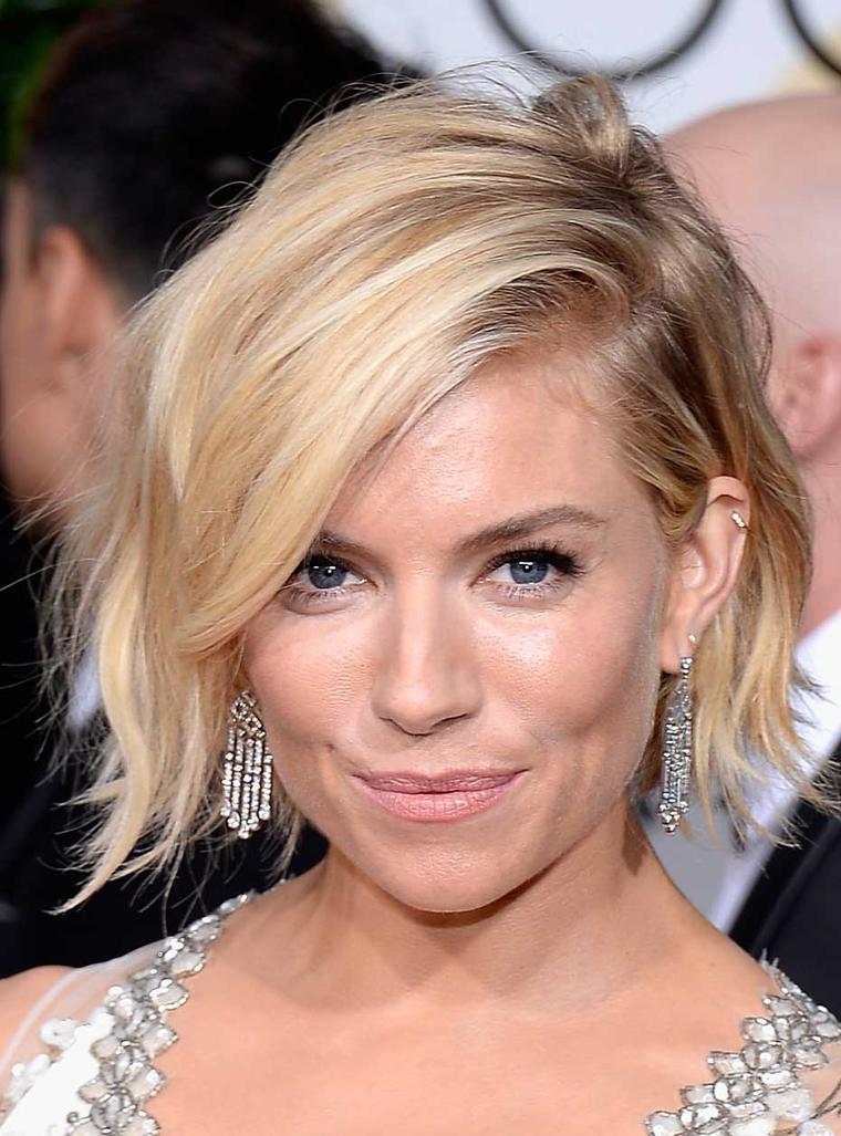 British actress Sienna Miller showcased these Platinum and diamond drop earrings from Tiffany and Co. at the 2015 Golden Globe Awards. (Getty Images)