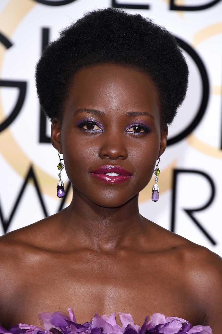 At the 2015 Golden Globes Lupita Nyong’o wore a Giambattista Valli couture gown and amethyst Chopard earrings.