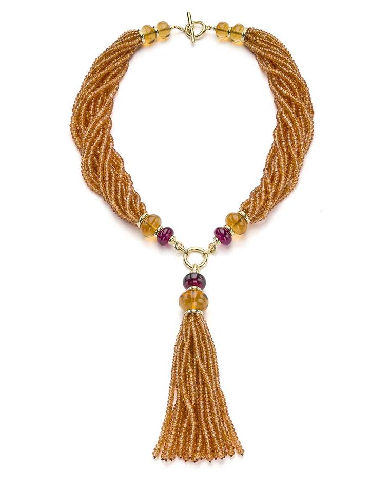 Goshwara tassel necklace set with 505.40ct mandarin garnet beads, accented by rubellite and citrine beads.