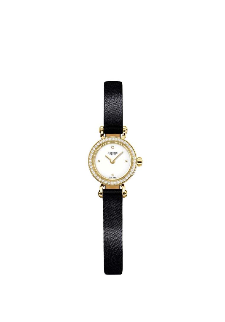Hermès Faubourg watch with a yellow gold case and black satin strap