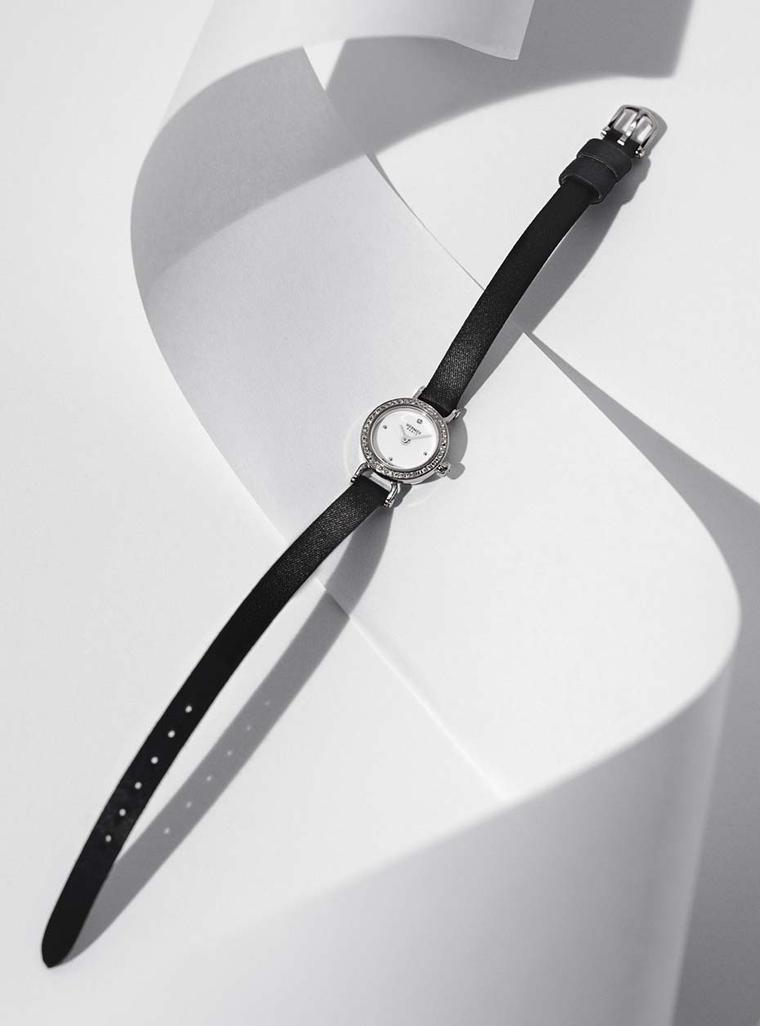 Hermès Faubourg watch featuring a diamond-set white gold case and black satin strap