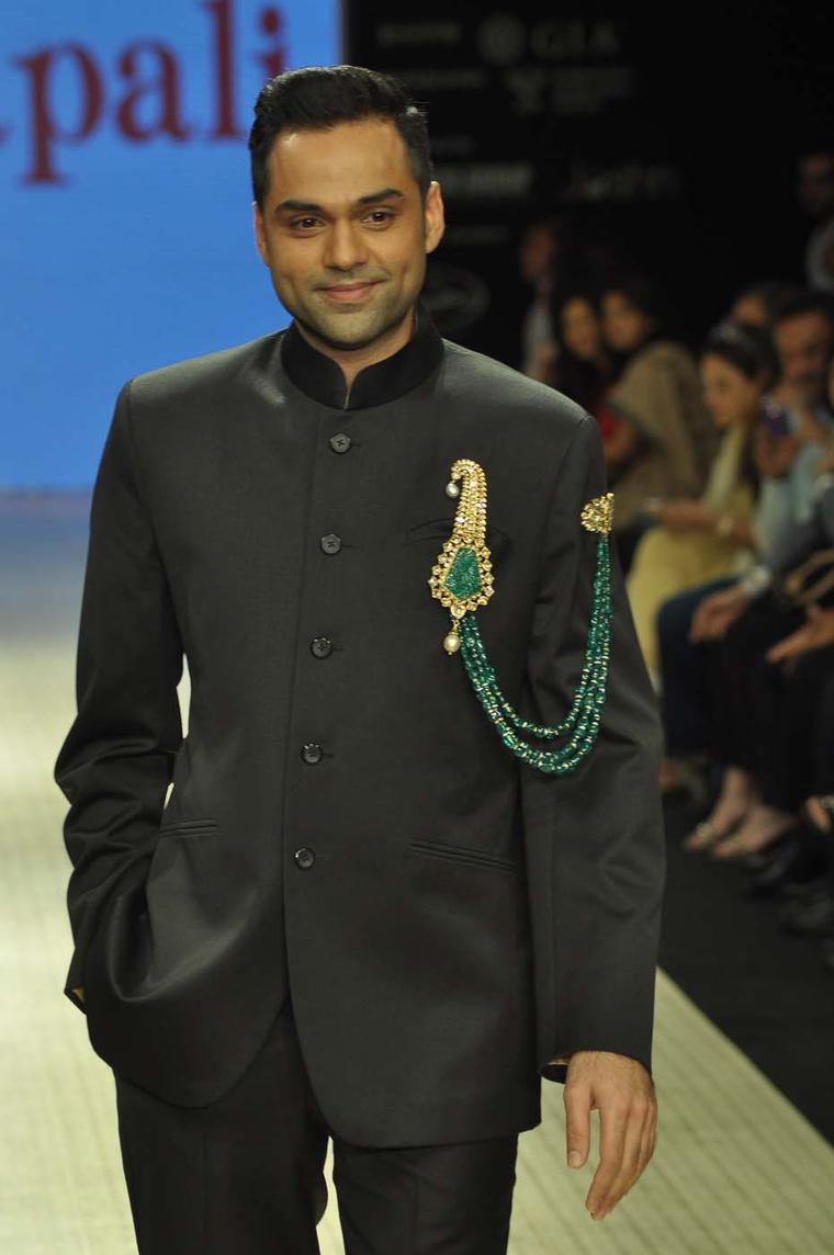 Actor Abhay Deol wearing an Amrapali emerald and kundan polki double pin brooch at Indian International Jewellery Week 2012.
