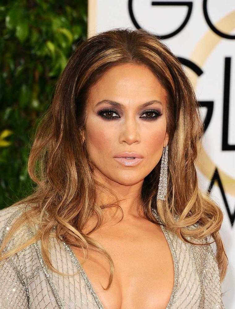Jennifer Lopez was daring as always in plunging, sequined Zuhair Murad and dangling Lorraine Schwartz diamond earrings. (Startraks)