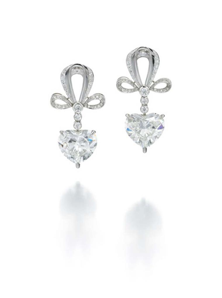 Jessica McCormack Heart Drop earrings in platinum featuring three brilliant-cut diamonds leading to a 4ct heart-shaped diamond