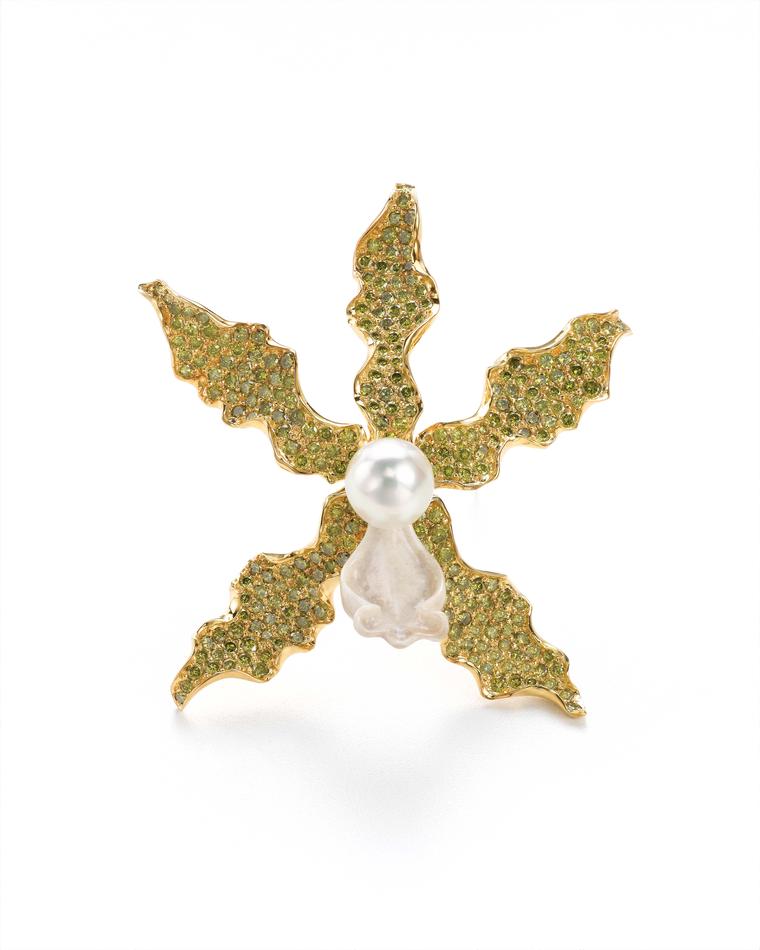 K. Brunini Objects Organique orchid pink in yellow gold with 15.88ct green diamonds, a carved bone trumpet and a South Sea Pearl.