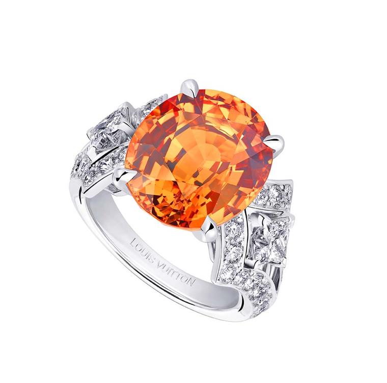 Louis Vuitton ring from the Acte V high jewellery collection, set with a central mandarin garnet surrounded by diamonds.