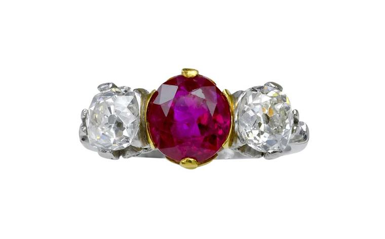 Lucie Campbell Burmese ruby engagement ring in platinum flanked by brilliant-cut diamonds.