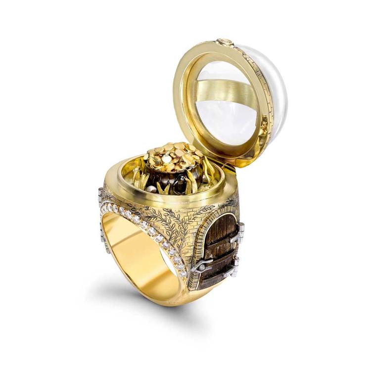 Theo Fennell's Over the Rainbow ring in yellow gold with pavé diamonds and rock crystal opens to reveal your very own pot of gold.