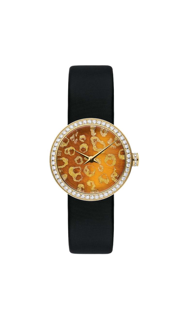 Dior D de Dior Mitza watch in yellow gold with a diamond-set bezel and crown surrounding a tiger’s eye stone dial hand-painted with golden leopard spots.
