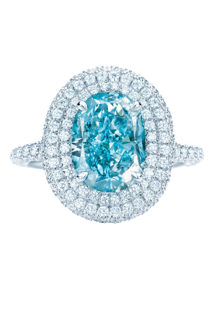 Tiffany & Co. double Halo blue diamond engagement ring encircled by pavé diamonds.