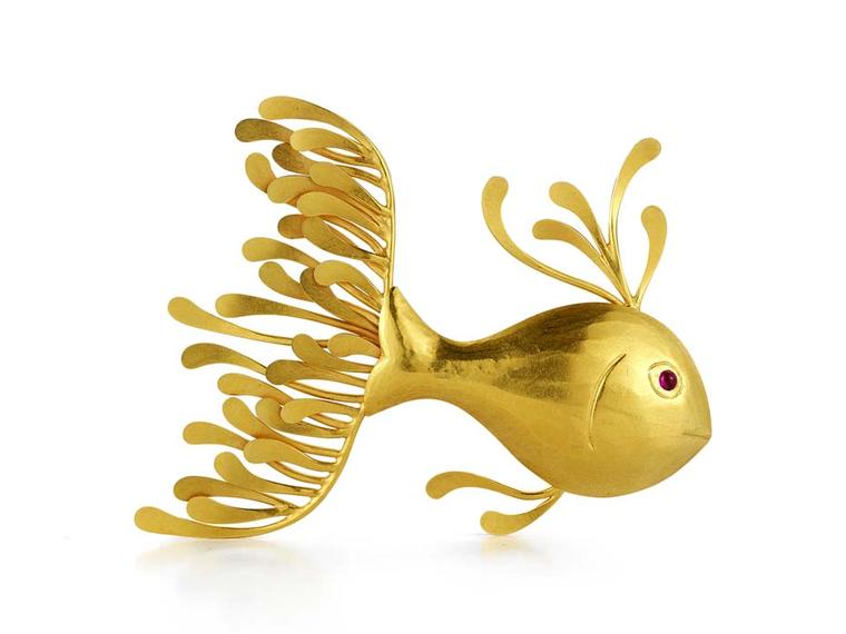 McTeigue & McClelland Flora Fish pin made in yellow gold with a cabochon ruby eye ($4,700).
