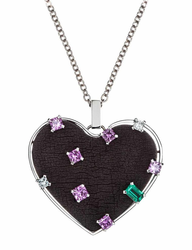Wilfredo Rosado necklace in white gold with emeralds, pink sapphires and diamonds set into a burnt wood heart pendant.