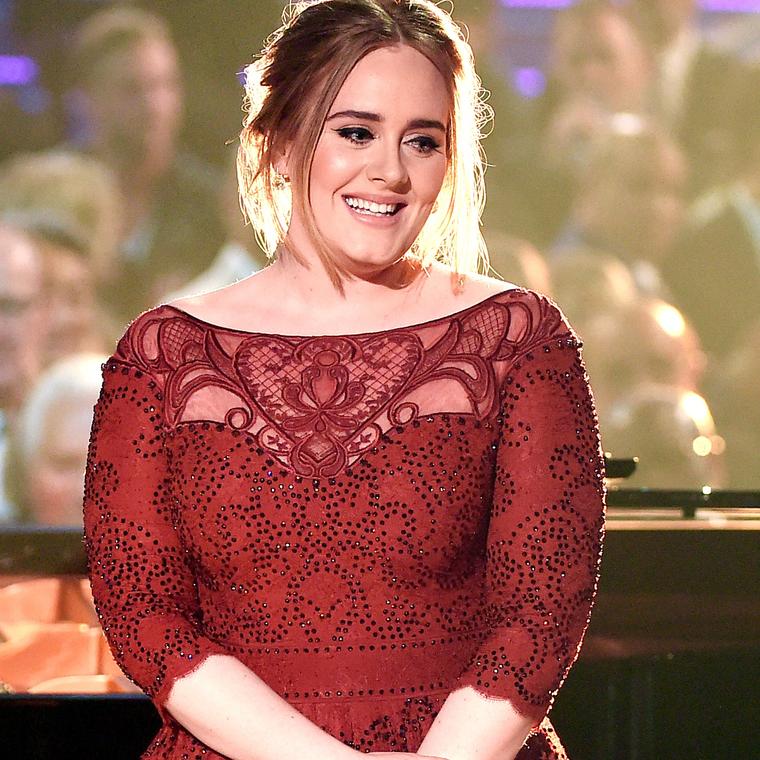 Adele wearing Harry Winston yellow diamond earrings