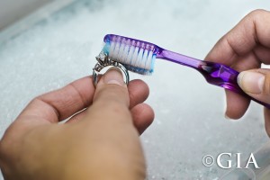 Use a gentle touch when cleaning your jewelry with a toothbrush and warm soapy water. Photo: Eric Welch/GIA