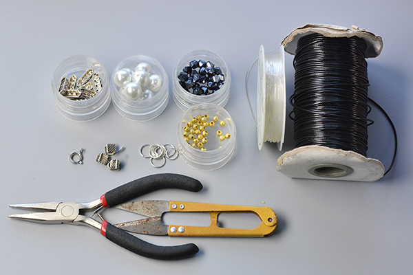 Supplies needed for this black leather cord pearl necklace making: