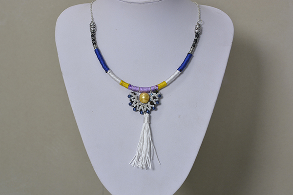 final look of the handmade cord wrapped necklace with beads and tassel pendant