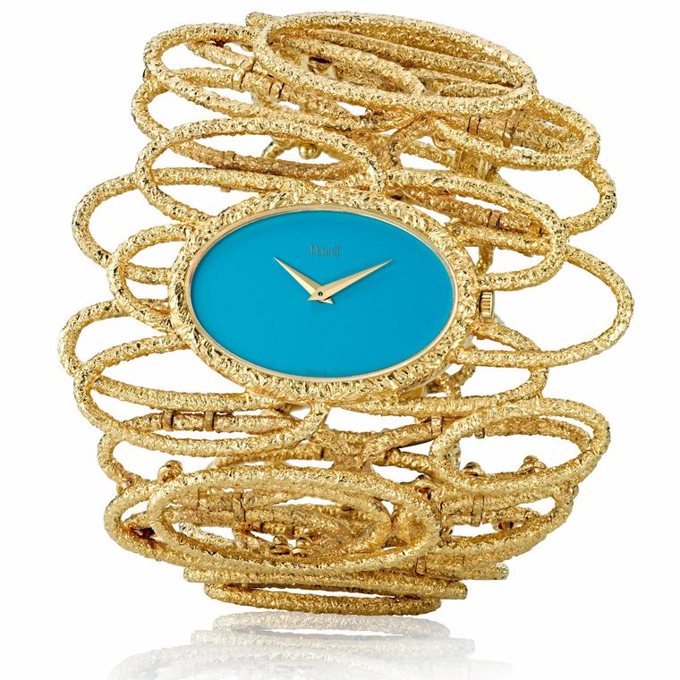 Piaget vintage cuff watch in yellow gold with a turquoise dial 