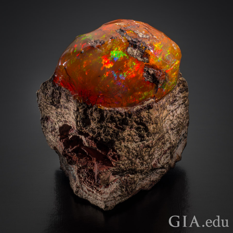 Rough Mexican fire opal in rhyolite