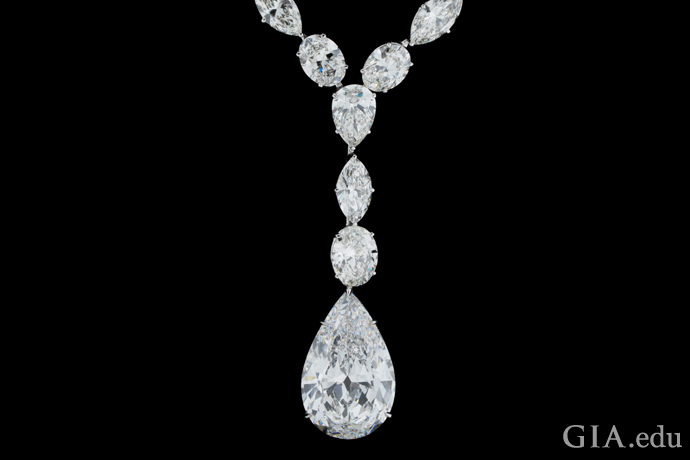 A necklace featuring a 25.04 ct pear shape diamond suspends from 64.24 carats of diamonds