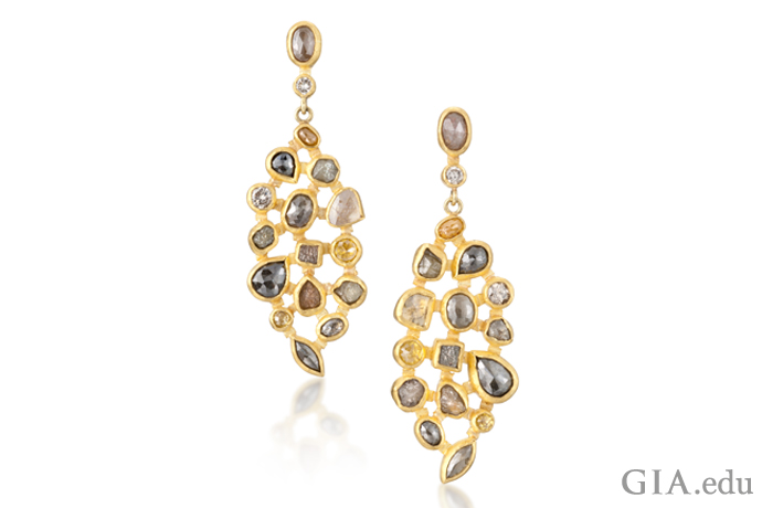 Yellow gold earrings set with rough diamonds. 