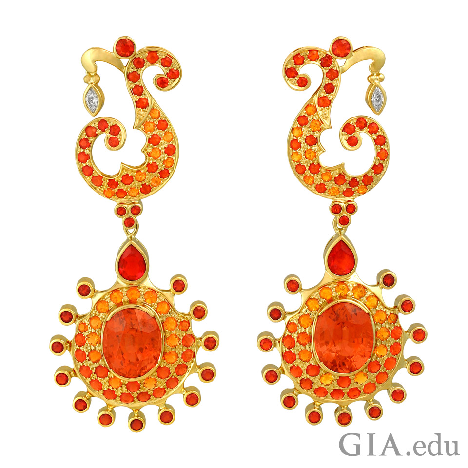 October birthstone earrings consisting of Mexican fire opals, spessartine garnets and diamonds 