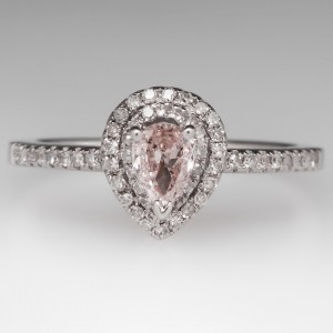The center stone, a 0.36ct Fancy Light pink pear-shaped diamond, appears larger when set in a double halo ring. Courtesy: www.eragem.com