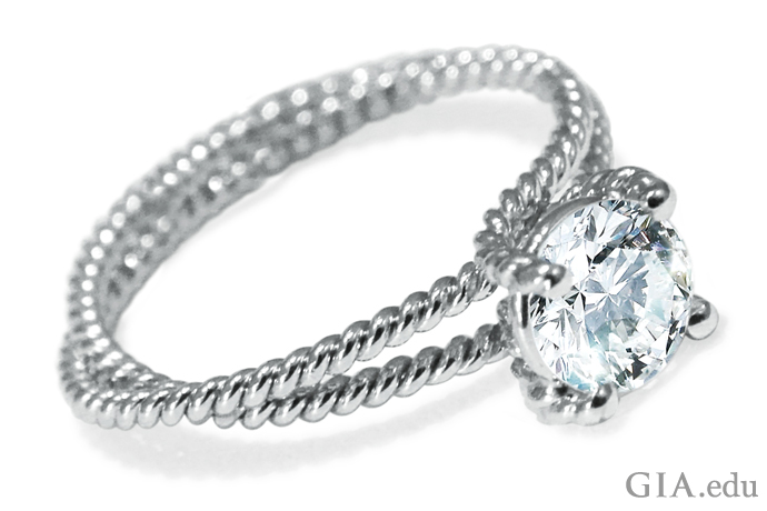 Round brilliant cut diamond engagement ring with platinum braided double shank.
