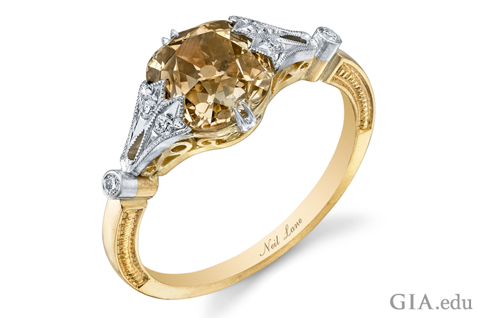 This yellow gold and platinum vintage-style engagement ring features a brown cushion-cut diamond.