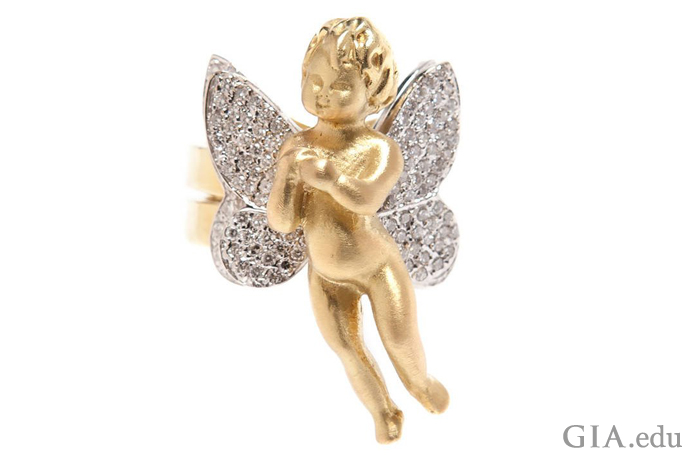 Cupid is the adorable child in this 18K gold ring with wings studded with 1.90 carats of diamonds. 