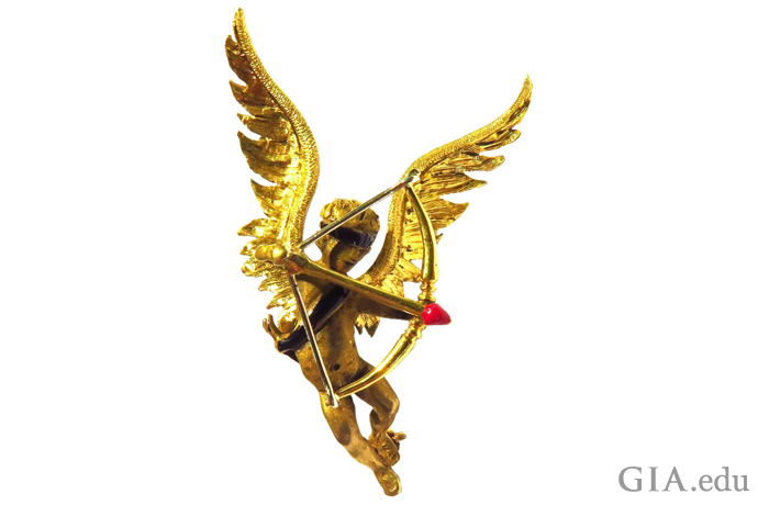 Sometimes Cupid is blindfolded; sometimes he’s not. And sometimes he just sports a blindfold on his forehead – as in this 18K gold pin. 