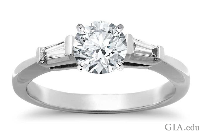1.28 ct round brilliant cut diamond engagement ring with tapered baguettes.