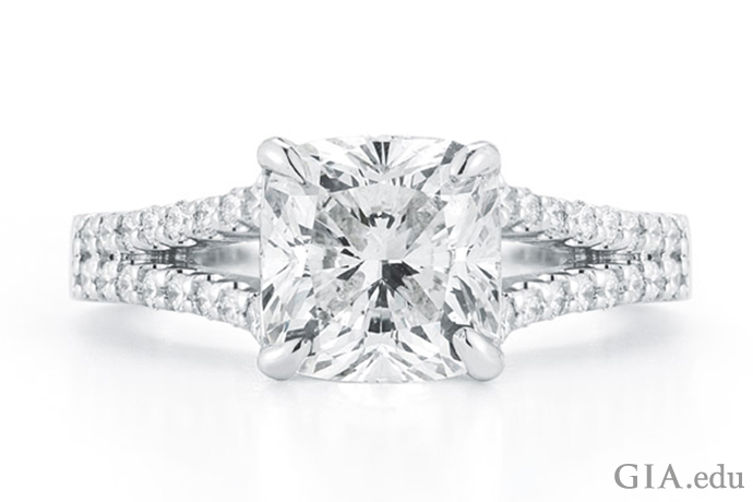 A 2.11 carat (ct) cushion cut diamond accented with 32 diamonds in the split shank