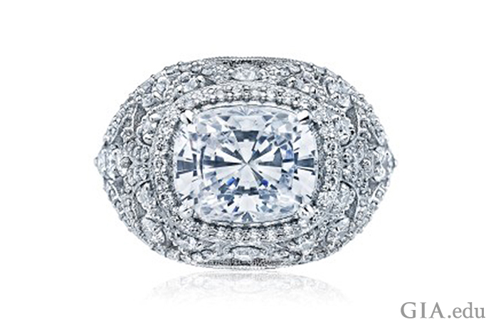 A cushion cut diamond engagement ring surrounded by an arrangement of small diamonds 