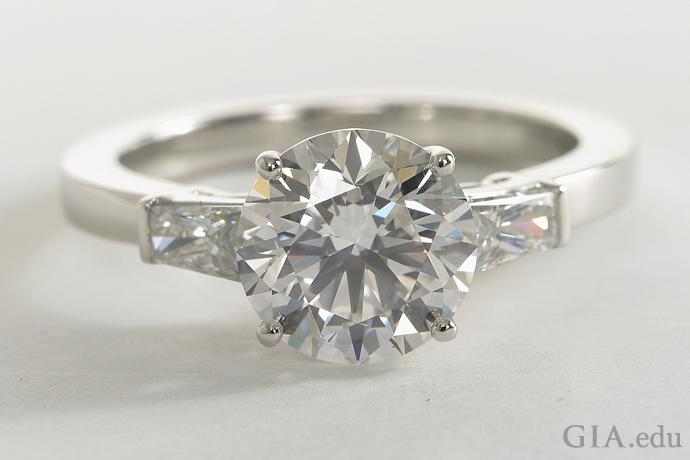 Tapered baguette diamond engagement ring with a 2.30 carat (ct) round brilliant center stone