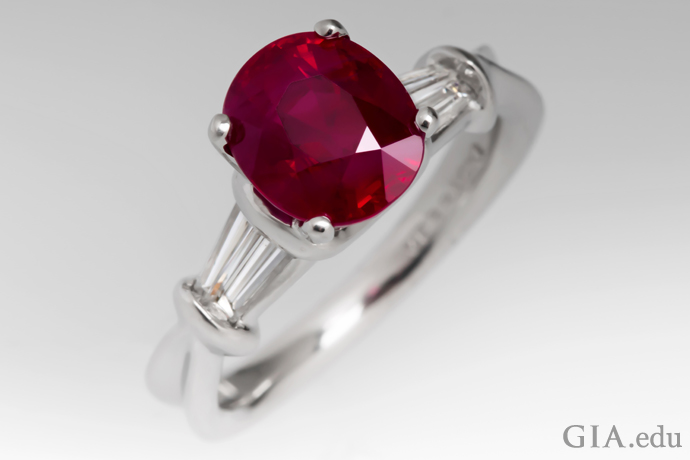 A 3 ct ruby ring flanked by two tapered baguette diamonds.